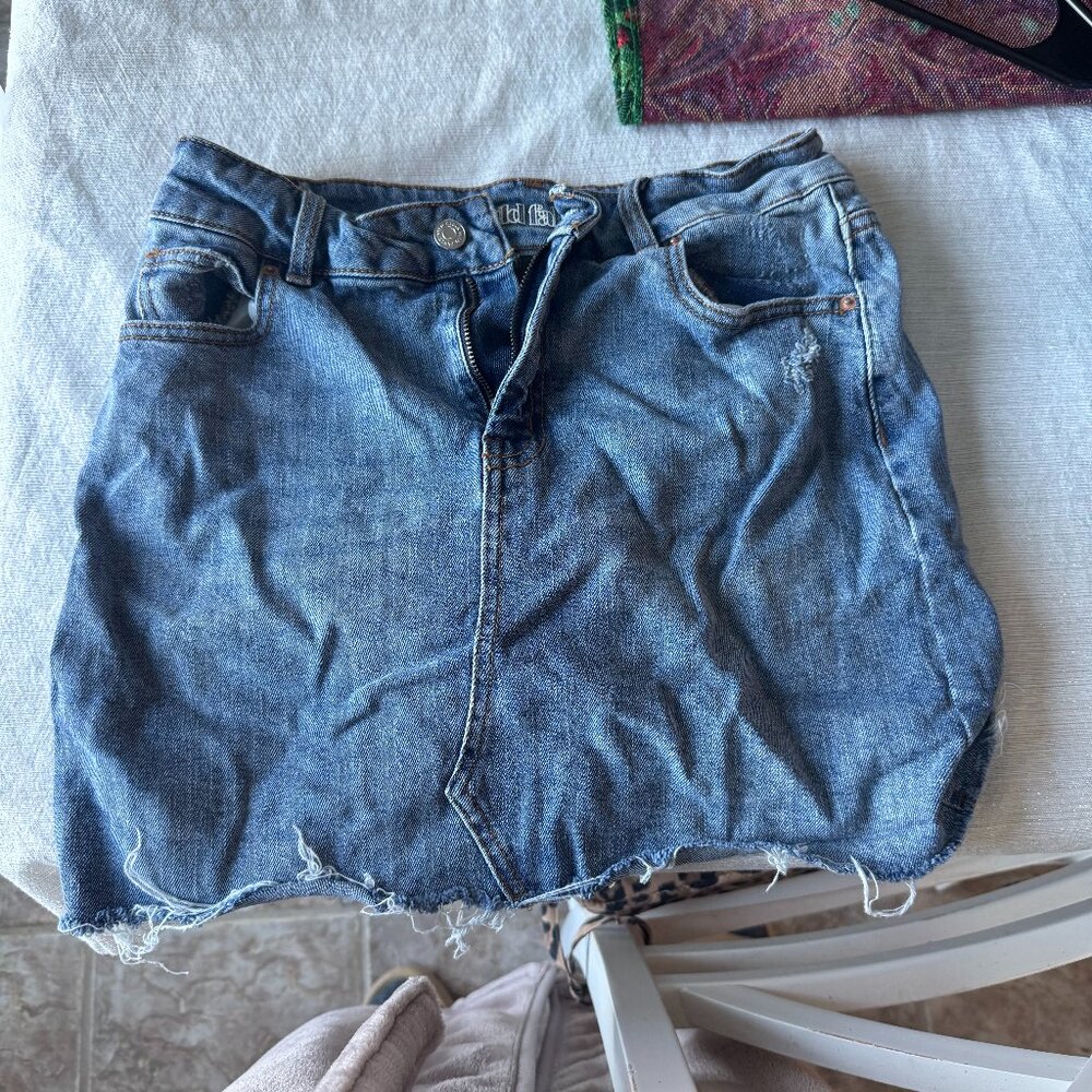 BARELY WORN distressed jean skirt